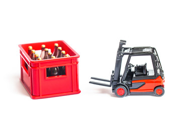 miniature worker with red plastic container of drink bottle