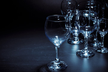 Empty  glasses for drinks on dark background
