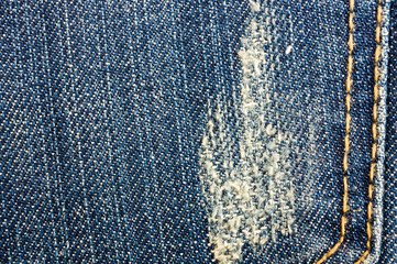 clothing items blue stonewashed faded jeans cotton fabric texture with seams, clasps, buttons and...