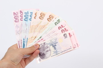 Turkey handful of paper money on a white background