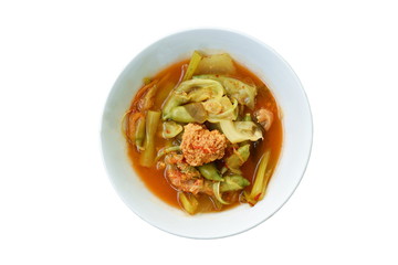 boiled mixed vegetable and fish egg in Thai spicy soup on bowl