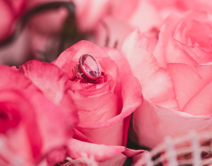 Blur Holiday concept Valentine's Day. Pink background with roses and engagement ring
