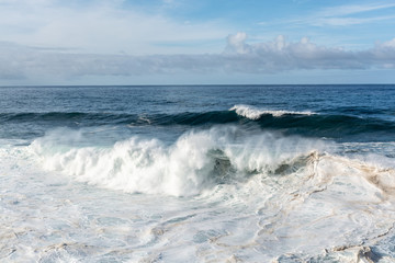 Dangerious ocean stormy waves hits black lava rocks by Faro de las Hoyas, La Palma island, Canary, Spain