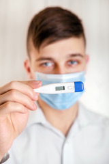 Young Man in Flu Mask