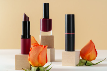 Cosmetics containers decorated with orange rose petals