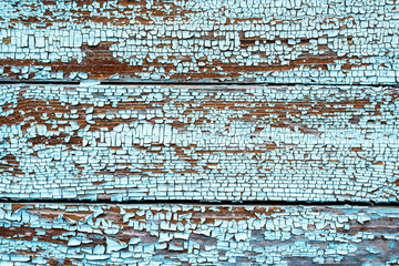 natural wood background. Dark boards covered with cracked bare paint.