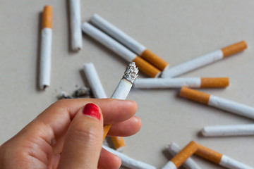 cigarette smoking  smoker nicotine woman addiction quit concept The cigarette in the girl's hand. She has a very heavy addiction to cigarettes and that means 