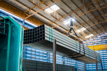 Electric Cable Hoist , heavy hoist iron hook lifting of Steel Pipes bunch and place on a truck at...