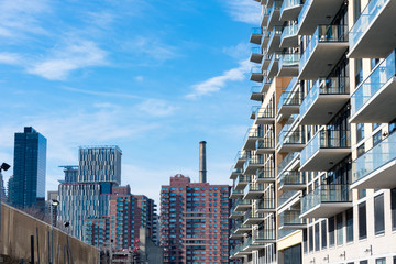 Residential Buildings along the Shore of Astoria Queens New York with the Roosevelt Island and Upper East Side Skyline