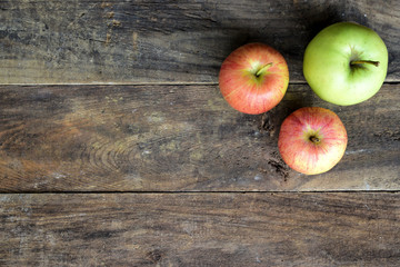 Three Apples on Wood Table
