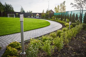 Cercles muraux Gris 2 landscaping of the garden. tile track, football field, thuja, lantern,