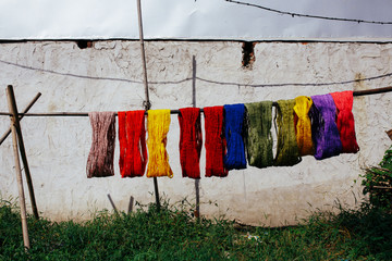 Handmade colorful cotton rolls drying on the sun 