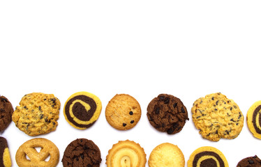 A group of assorted cookies. Chocolate chip, oatmeal, raisin, Danish cookies and biscuits in the shape of a spiral pattern isolated on white background and copy space.