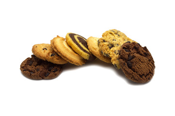 Stack of assorted cookies. Chocolate chip, oatmeal, raisin, Danish cookies and biscuits in the shape of a spiral pattern isolated on white background.