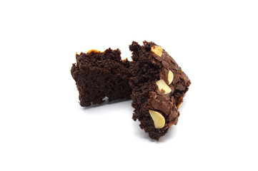 Pile of chocolate brownies with sliced almond nuts toppings broken isolated on white background.