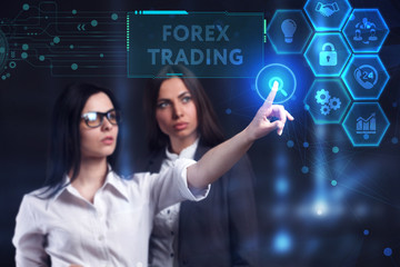 Business, Technology, Internet and network concept. Young businessman working on a virtual screen of the future and sees the inscription: Forex trading