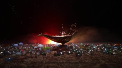 Antique Aladdin arabian nights genie style oil lamp with soft light white smoke, Dark background. Lamp of wishes concept