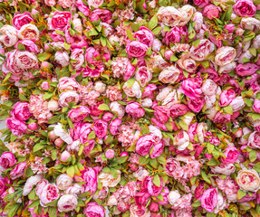 Beautiful background of artificial pink peonies. Wedding festive decoration. Floral rose background. Pink flowers background