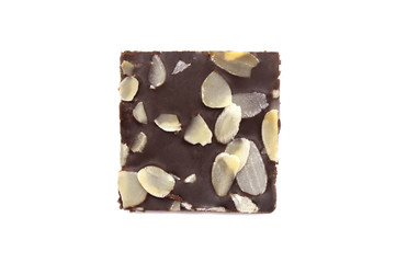 Chocolate brownie with sliced almond nuts toppings isolated on white background.