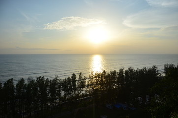 sunset over mountain beside sea shore in Cox's Bazar