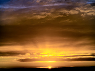 Fototapeta premium Fantastic dark thunderclouds at sunrise