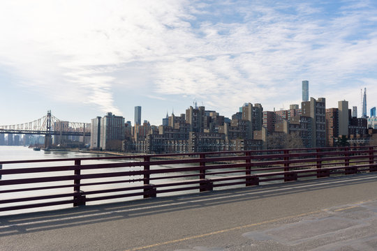 Empty Bridge over the East River leading to Roosevelt Island in New York City with the Skyline