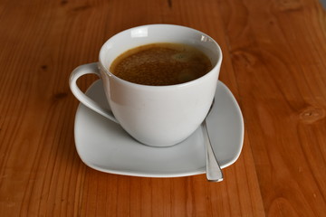 Coffee cup on wooden table