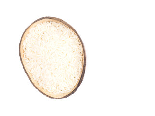 Indian long grain Basmati rice in half coconut shell isolated on white. Indian cuisine, ayurveda, naturopathy concept