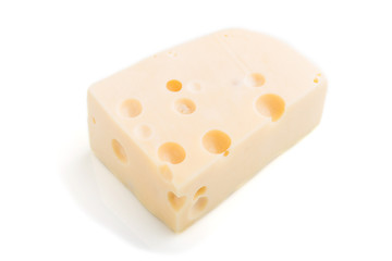 Piece of yellow cheese isolated on white background. Side view.