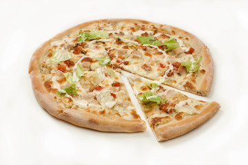 The pizza with chicken and green lettuce