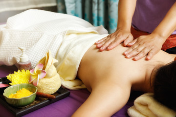 Obraz na płótnie Canvas Asian woman enjoying back massage in massage salon. Beauty treatment concept.