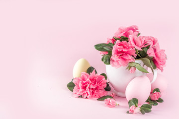 Tender Easter composition with easter eggs and pink spring flower branches
