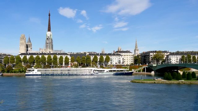 Rouen, Normandy, France - 26/10/2019 : view on the Seine river and on the Rouen Cathedral, a Roman Catholic church.