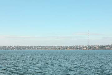 Obraz premium River landscape with blue sky and clouds in the distance