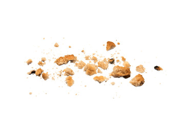 Scattered crumbs of chocolate chip cookies isolated on white background. Sweet biscuits delicious...