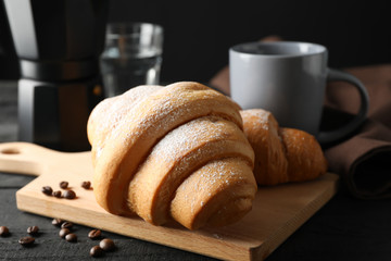 Composition with croissants on wooden table, close up