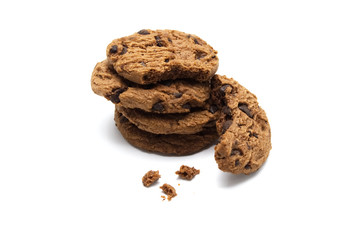 Pile of Chocolate chip cookies and crumbs on white background.