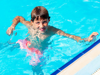 Child playing in the swimming pool