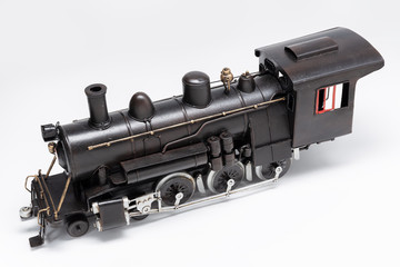 Old train machine tin toy isolated on white