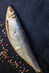 herring fish (healthy food, salted raw and spices) menu concept. food background. top view. copy space