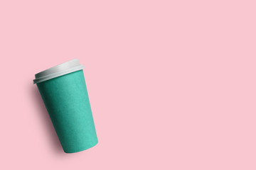 Simply flat lay design blue paper coffee cup isolated on pink pastel colorful background