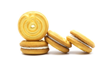 Sandwich cookies with coconut cream flavor isolated on white background. Stack of crunchy biscuits delicious sweet meal and useful cracker. Tasty sweet snack.