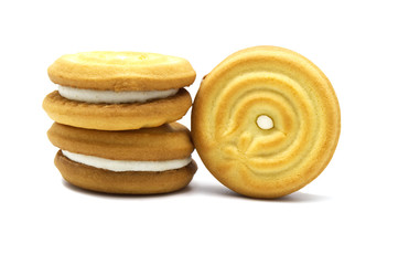 Sandwich cookies with coconut cream flavor isolated on white background. Stack of crunchy biscuits delicious sweet meal and useful cracker. Tasty sweet snack.