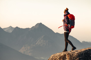 hiker on the top of mountain