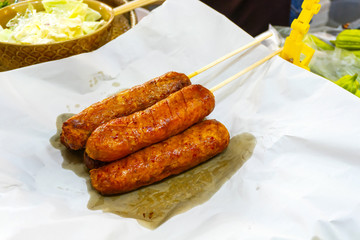 Pork sausage chicken fried dough coated, grilled crocodile ,sold the restaurant in Bangkok, Thailand