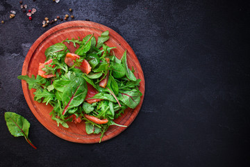healthy salad leaves mix, salmon or tuna (delicious snack) menu concept. food background. top view. copy space