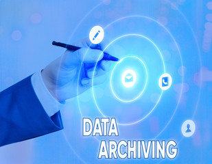 Conceptual hand writing showing Data Archiving. Concept meaning to secure and to store data for long term retention