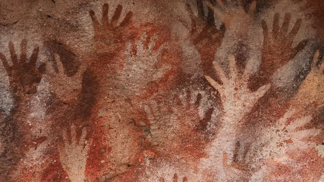 Prehistoric hand paintings at the Cave of Hands (Spanish: Cueva de Las Manos) in Santa Cruz Province, Patagonia, Argentina. The art in the cave dates from 13,000 to 9,000 years ago.