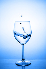 Glass with water up and splash