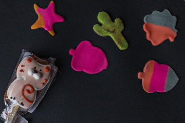 Making edible marzipan figures with your hands and cookie cutters to decorate baking. Ready-made...